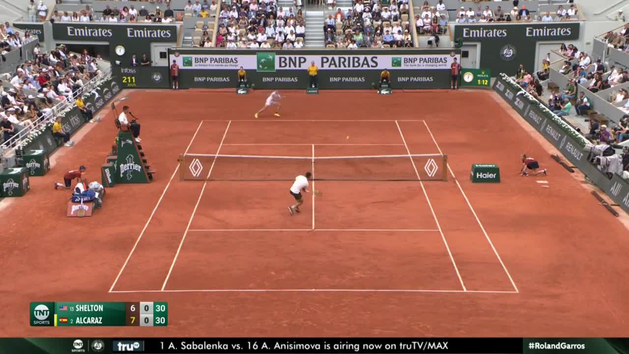 Carlos Alcaraz tosses his racket and lands an incredible shot at the Roland-Garros tennis French Open.