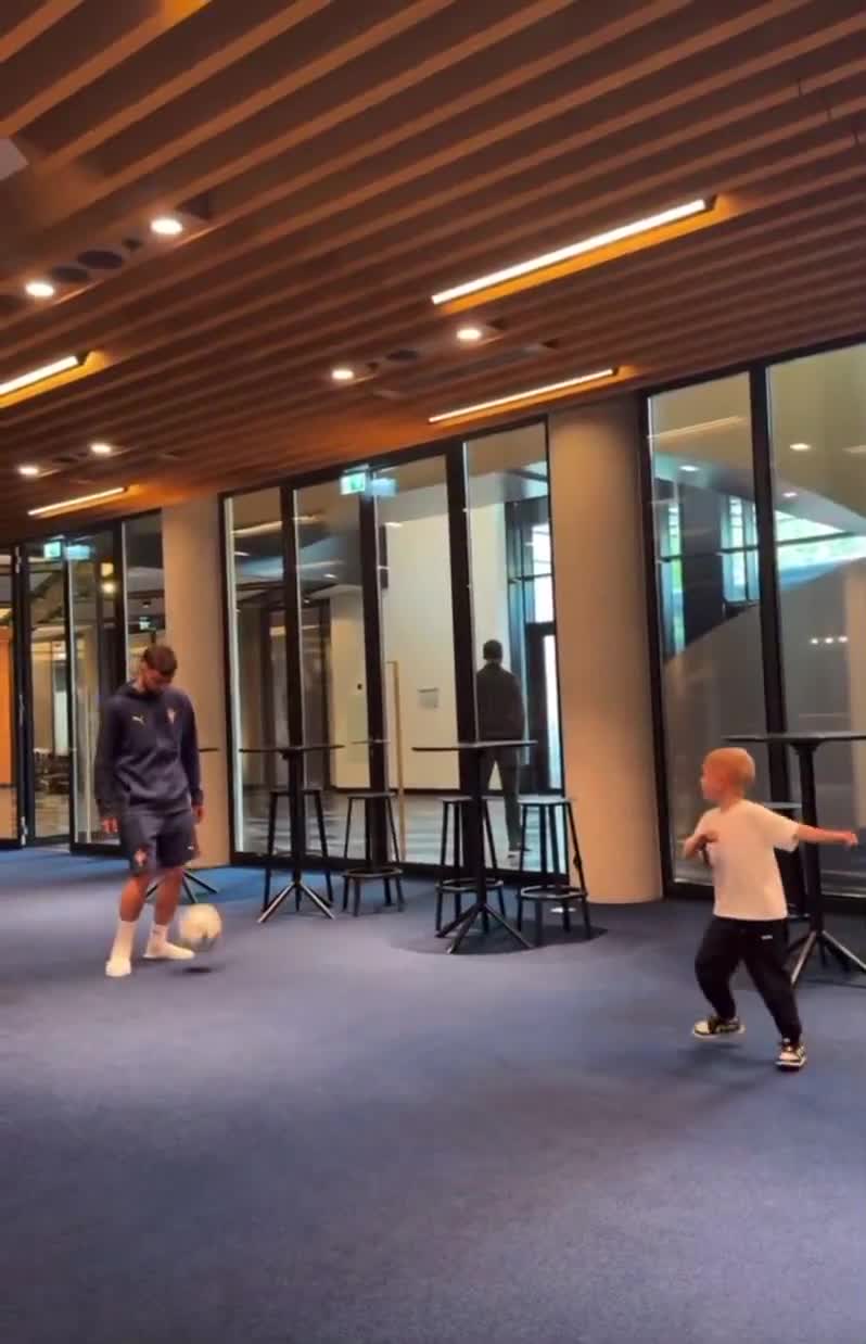 Bruno Fernandes playing footy with his son