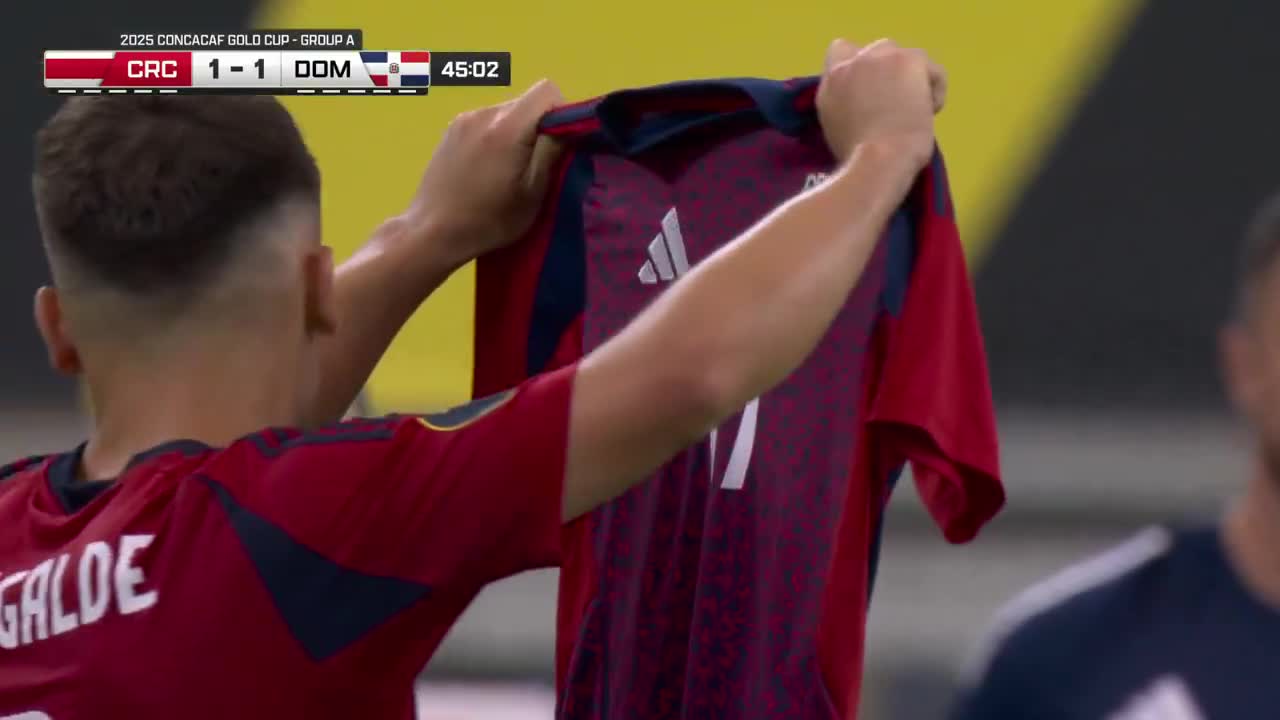 After scoring, Manfred Ugalde held up the shirt of Costa Rica teammate Warren Madrigal, who suffered an injury vs Suriname