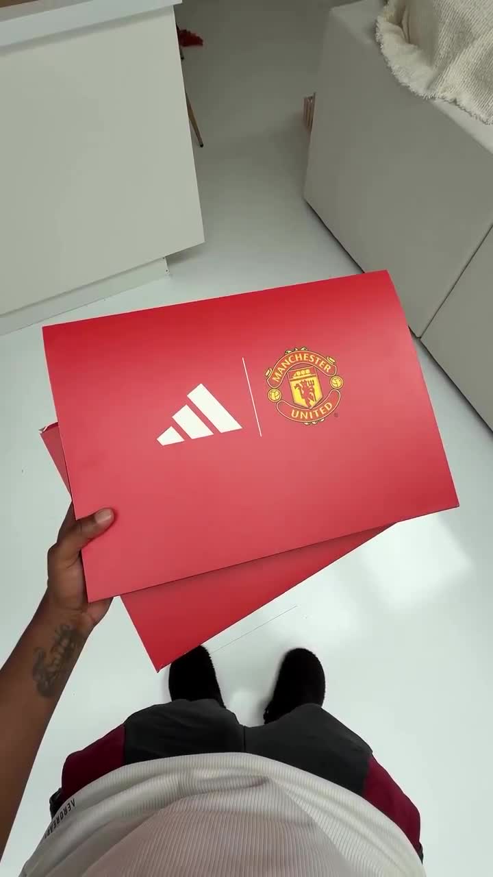Her reaction after receiving a full Manchester United gift pack from her dad