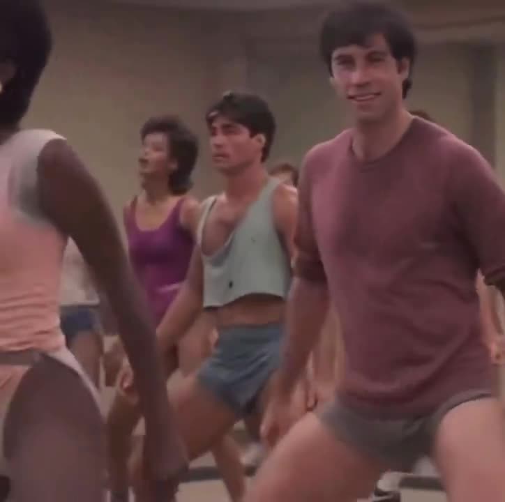 Jamie Lee Curtis doing aerobics in Perfect (1985) — peak 80s energy, fashion, and attitude.