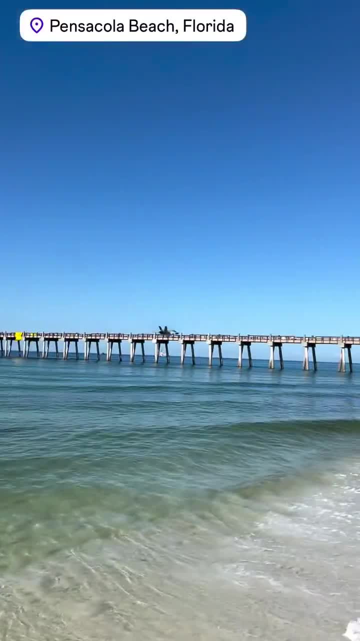 Praise the cameraman who caught this plane flying perfectly through a bridge gap and soaring into the sky