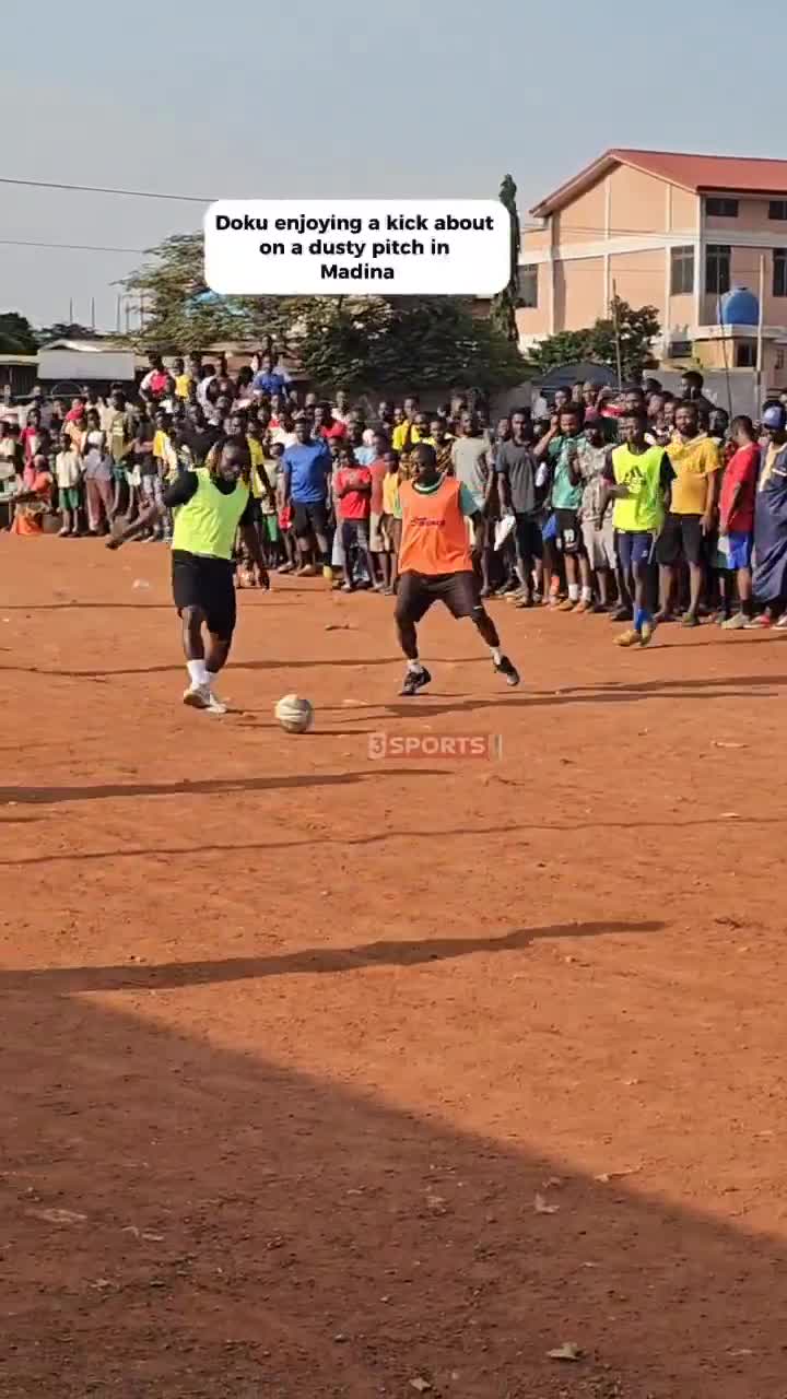 Jeremy Doku showing off his skills on a dusty pitch in Madina.