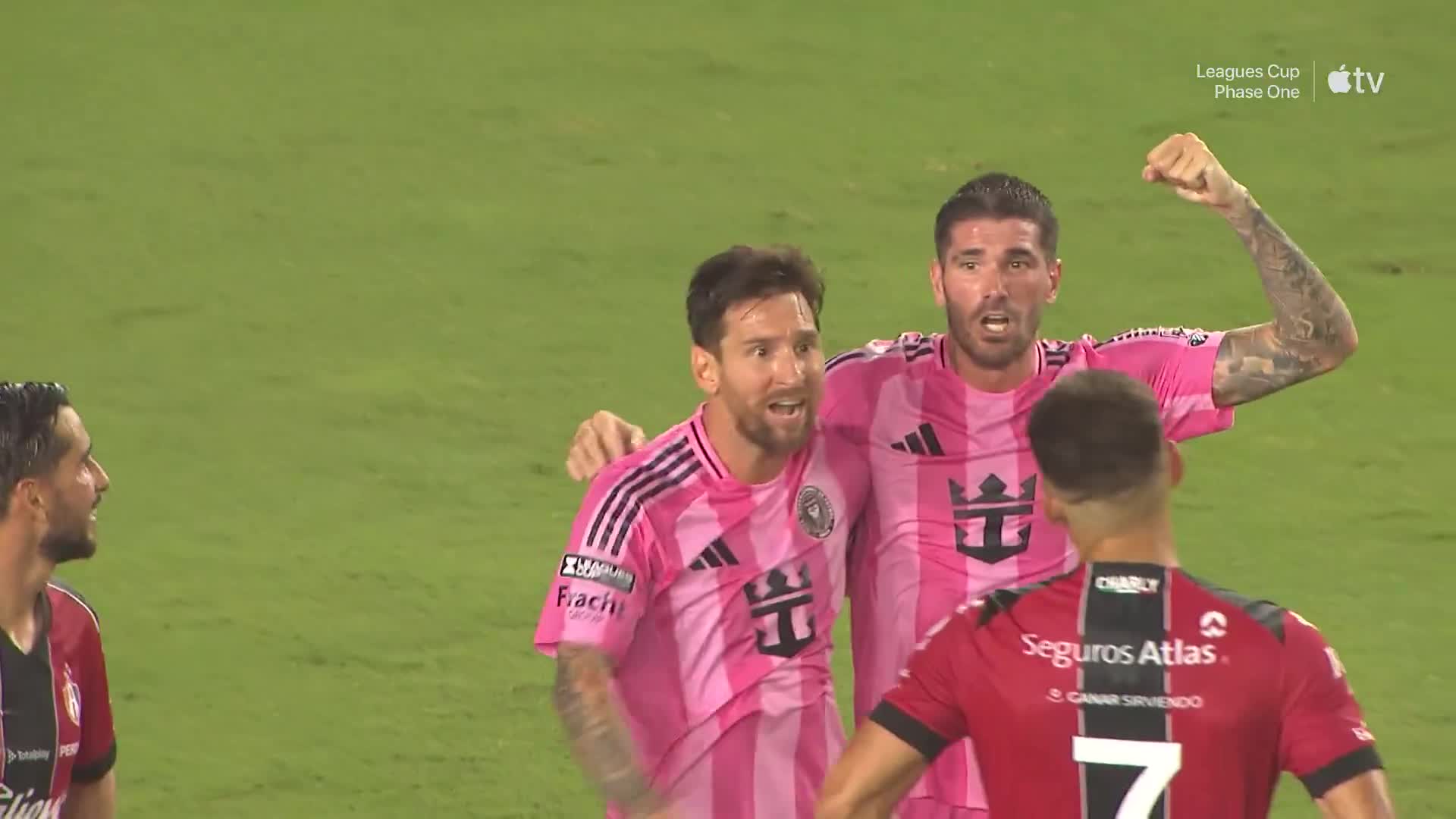 Messi celebrates after the 2-1 victory against Atlas