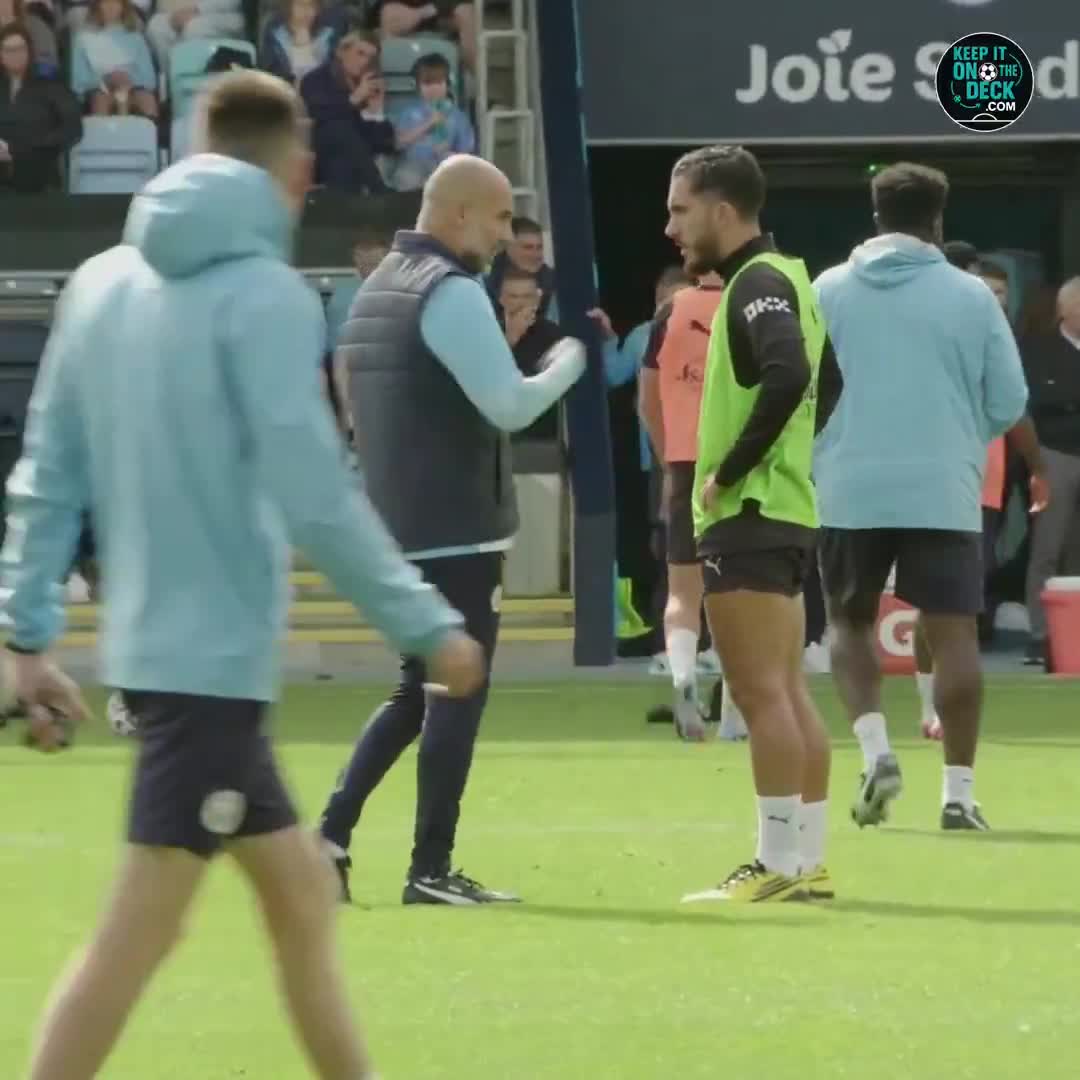 Pep Guardiola talking to Rayan Cherki in training after he lost the ball and didn't react fast enough