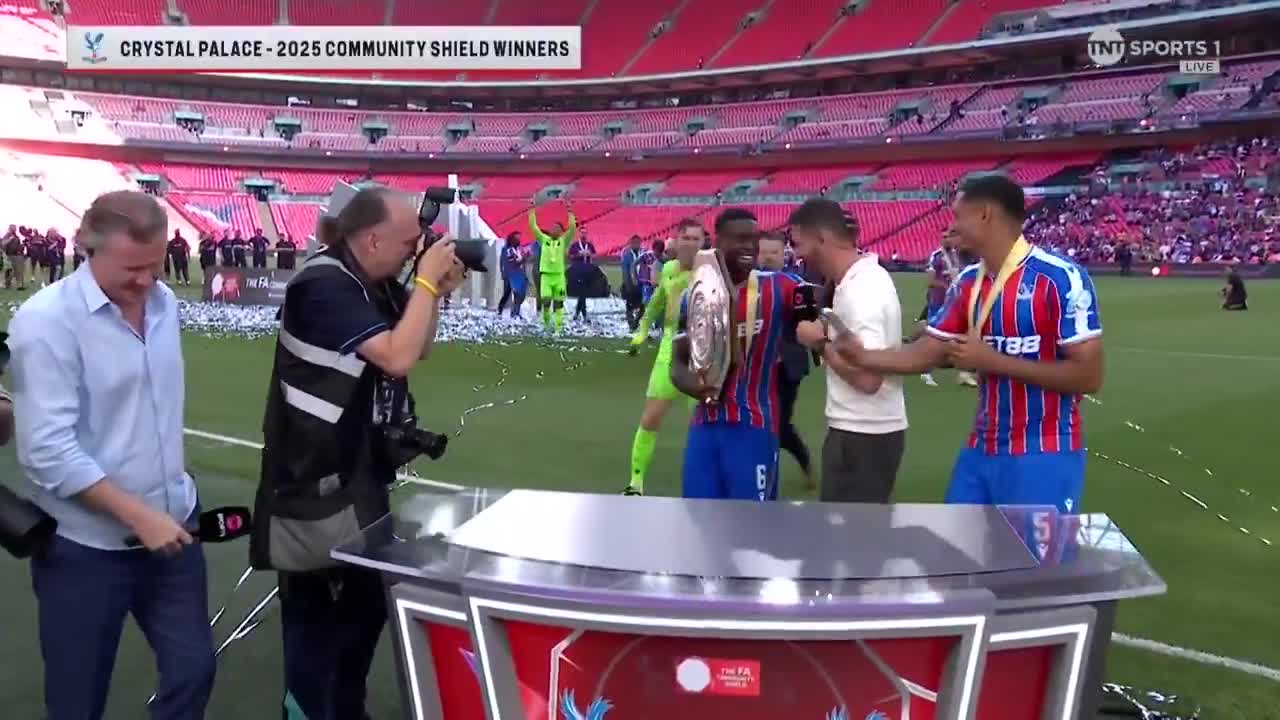 Joel Ward is mobbed by his former Palace teammates after their victory against Liverpool
