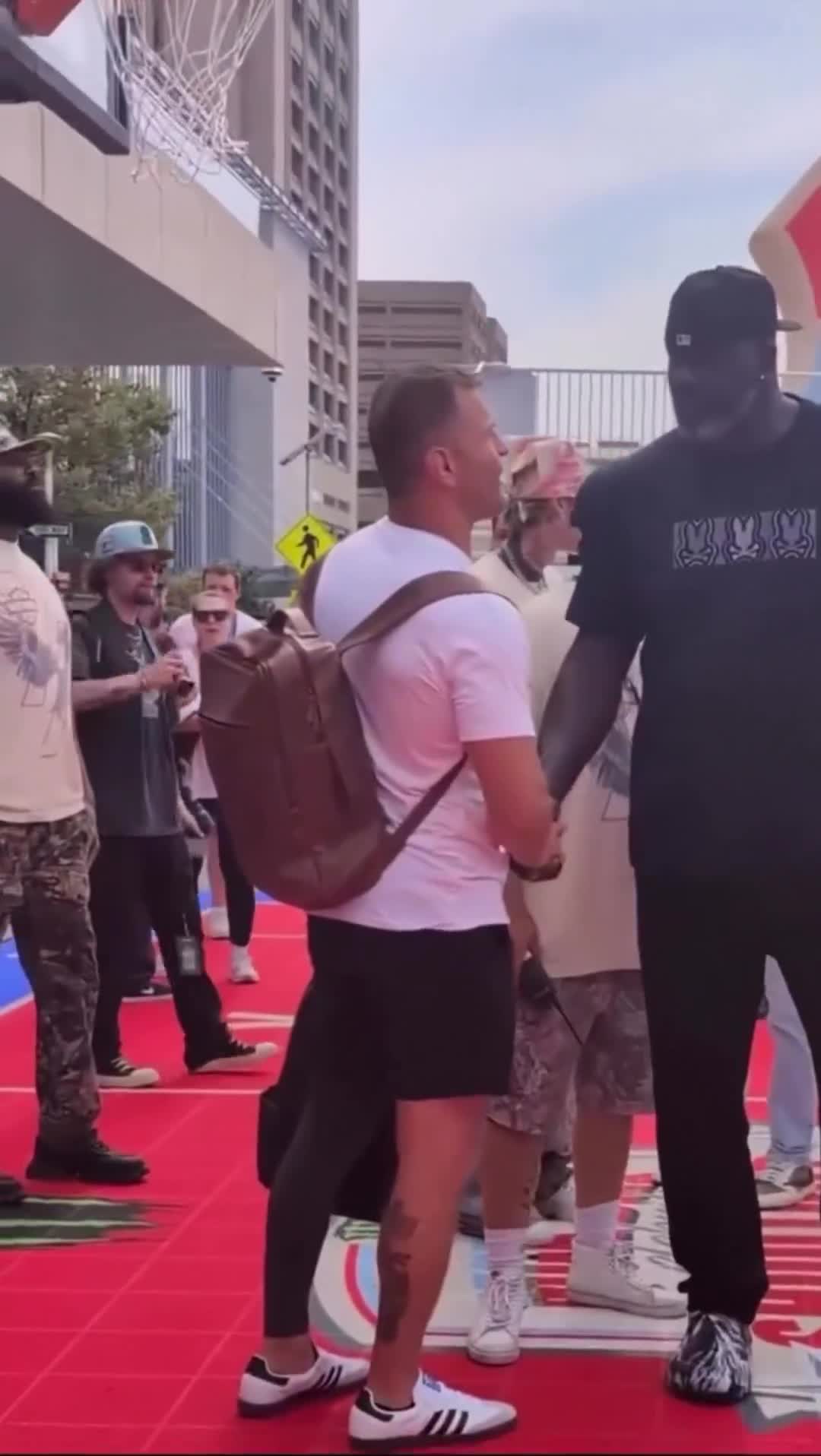 Former UFC heavyweight champion Stipe Miocic standing next to Shaq — the size difference is unrea