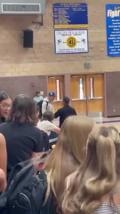 Kid attacks a teacher and gets put in a suplex by a police officer