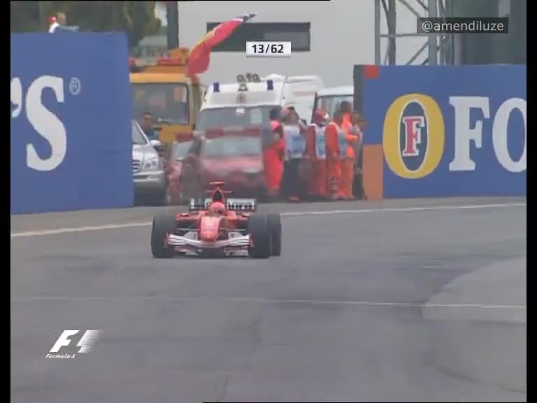 23-year-old Alonso defends against Schumacher to take victory despite engine problems