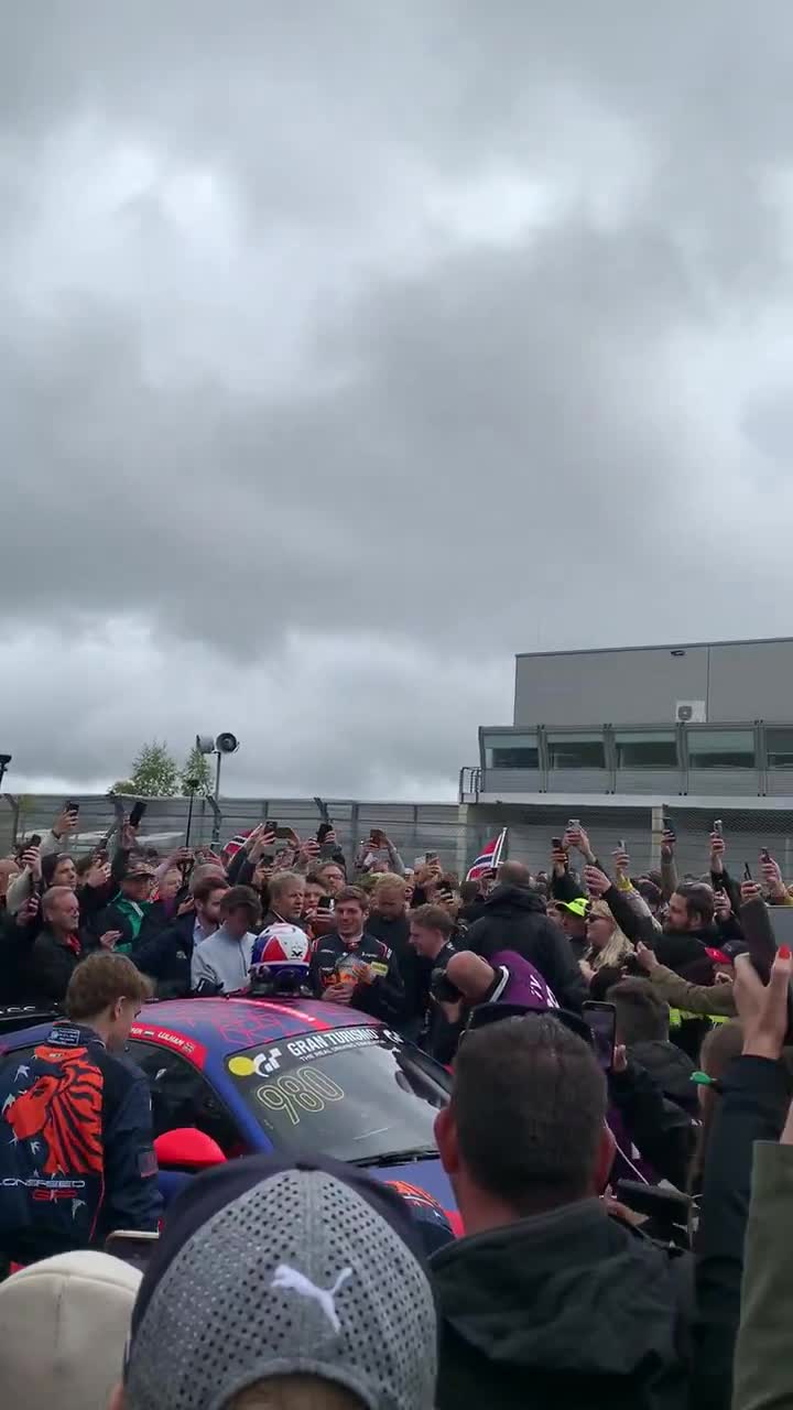 Fans surround to welcome and take photos of Max Verstappen