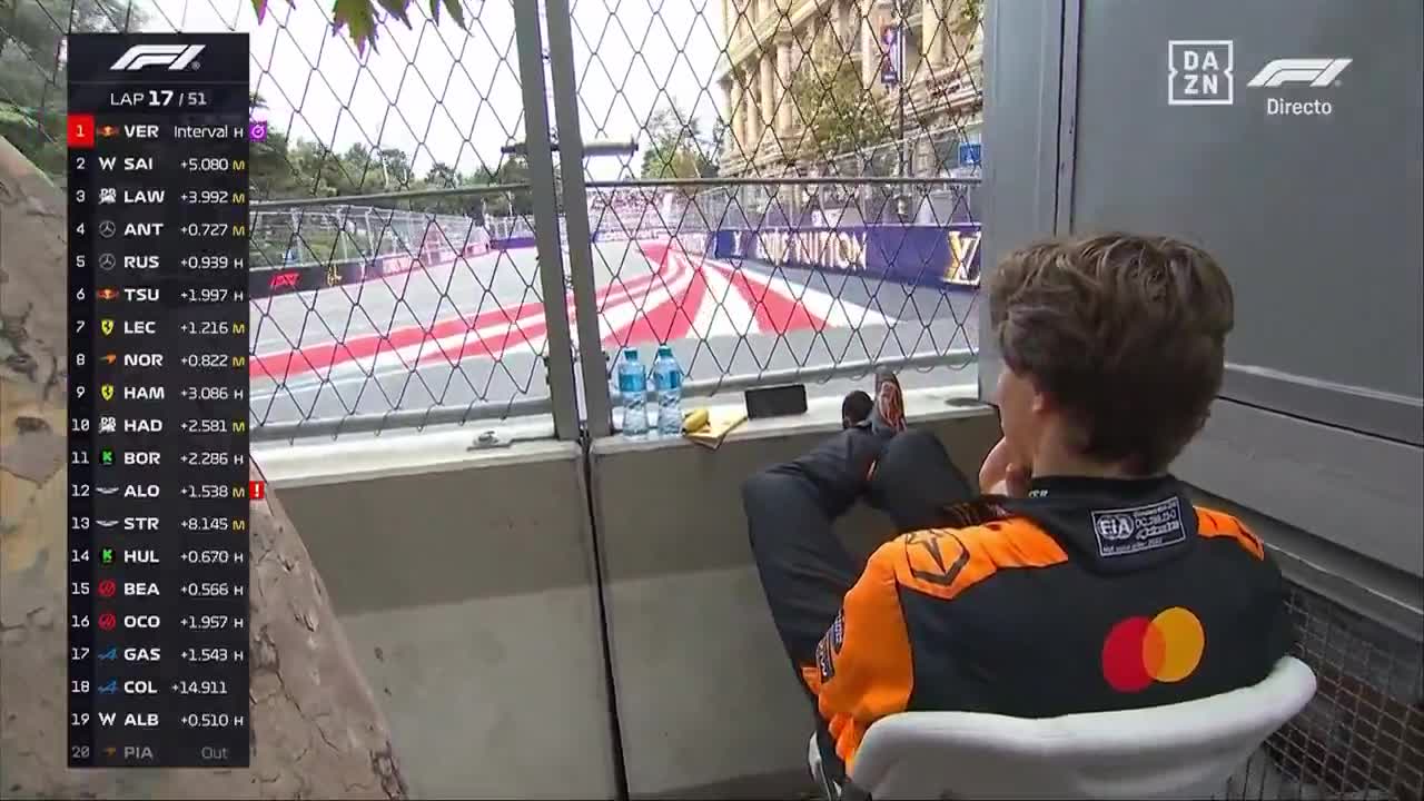Oscar Piastri watching the race on his phone