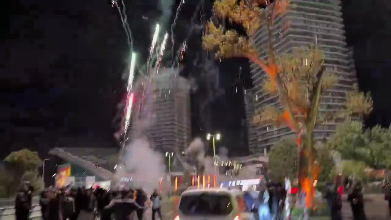 Galatasaray fans let fireworks off outside of Liverpool's team hotel.