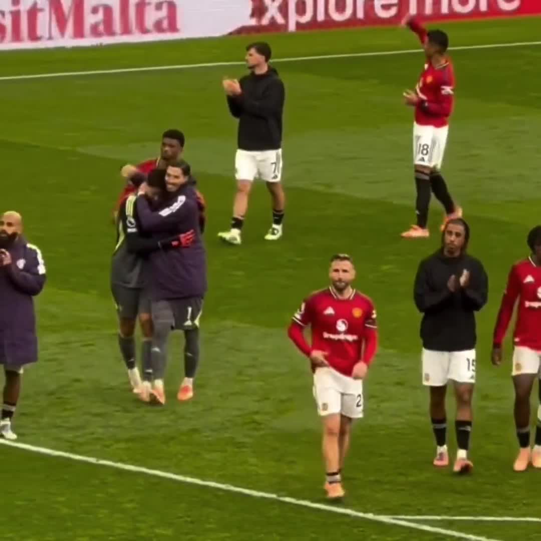 Altay Bayindir going over to congratulate Senne Lammens on his debut.