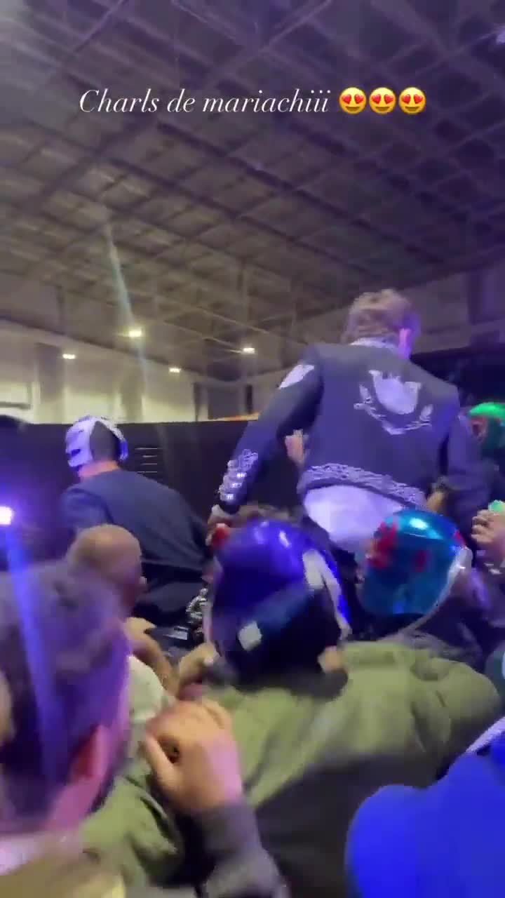Mexican fans let Charles sit on their shoulders to take a picture.