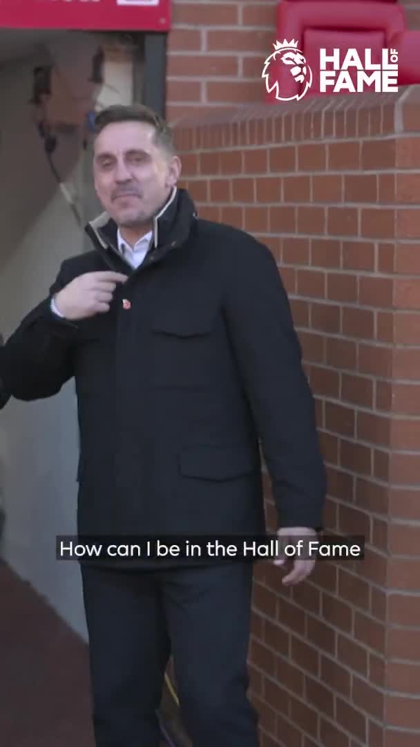 Gary Neville receives his Premier League Hall of Fame medallion from his boyhood hero, Bryan Robson