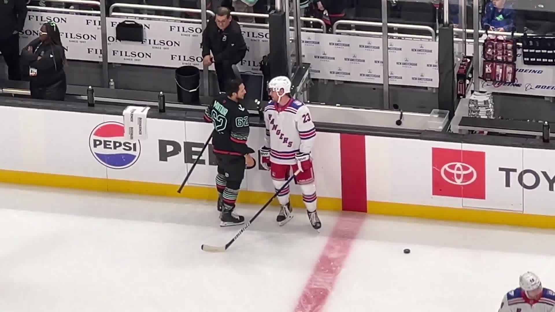 During warmups Saturday, Adam Fox and Brandon Montour had a conversation at center ice during warmups