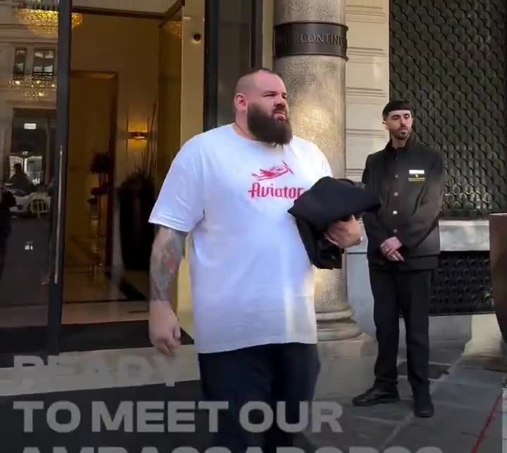 Alex Pereira walking around Italy with 2 belts on his shoulders