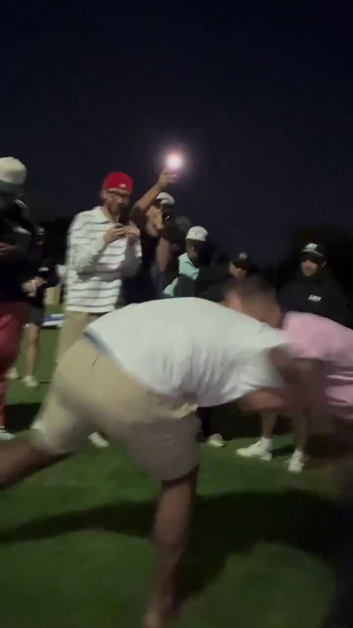 Justin Gaethje wrestling some random dude on a golf course
