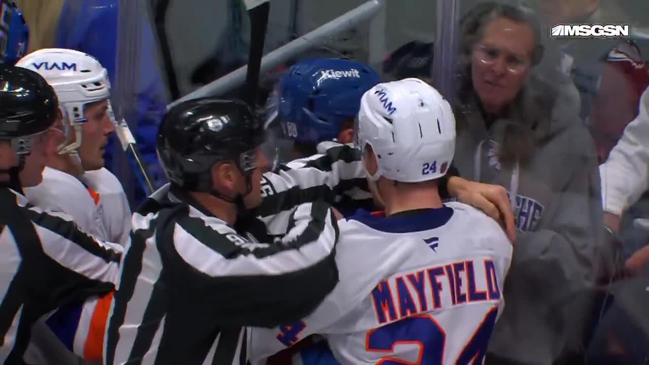 The fan’s reaction to the scrum on the boards right in front of her