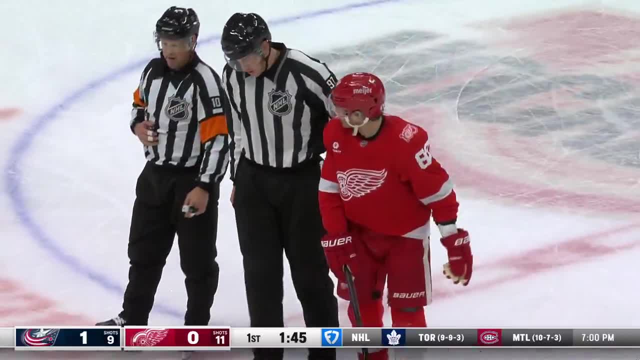 The referee orders Kane to go to the penalty box.
