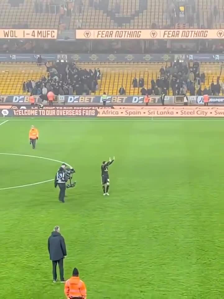 Matheus Cunha with Wolves fans at the end of the game
