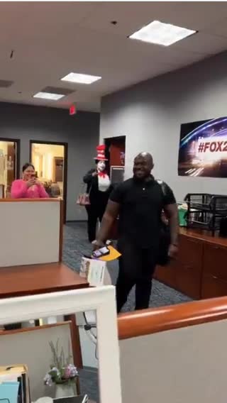 His reaction to his coworker dressing up as him for Halloween.