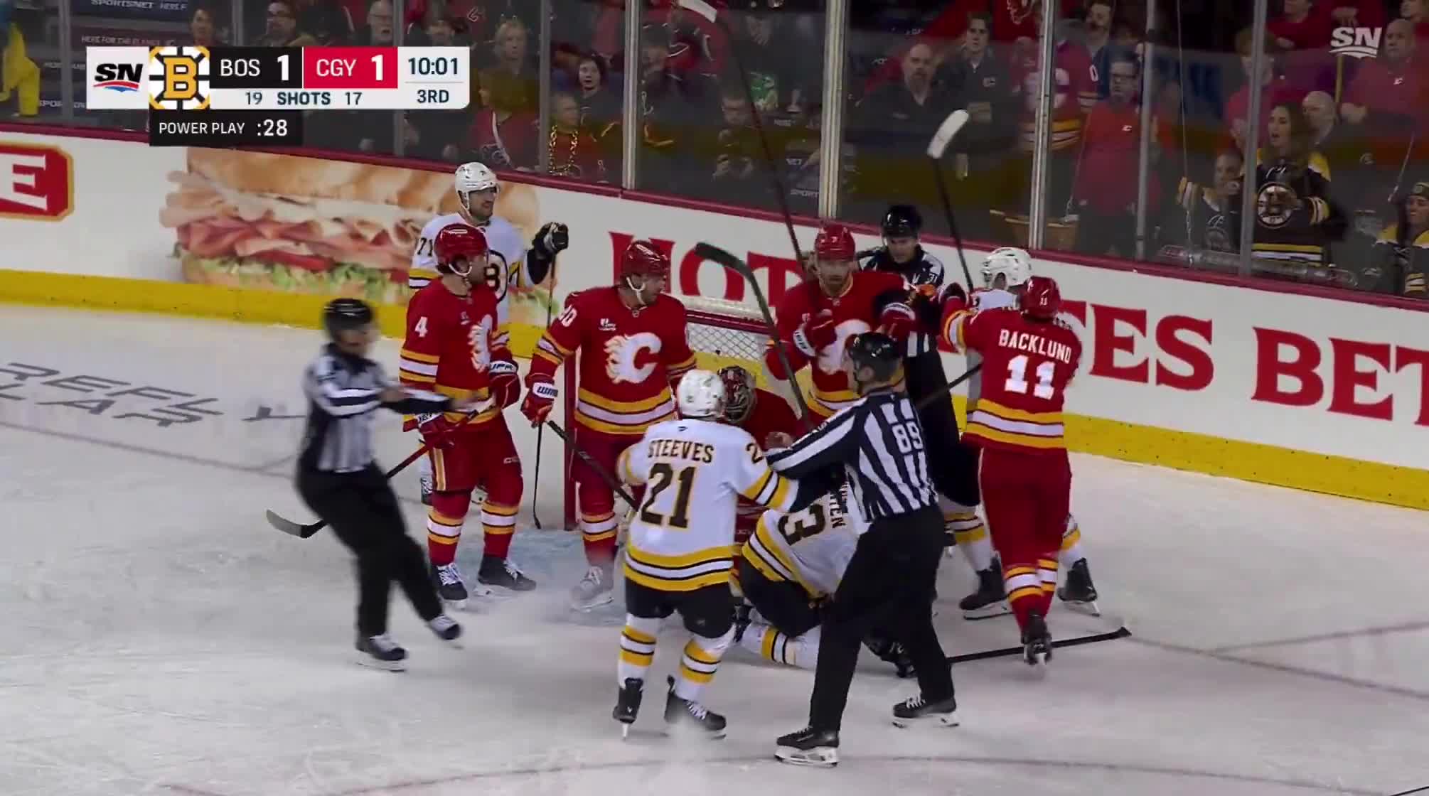 Fraser Minten getting bullied in front of the Flames net