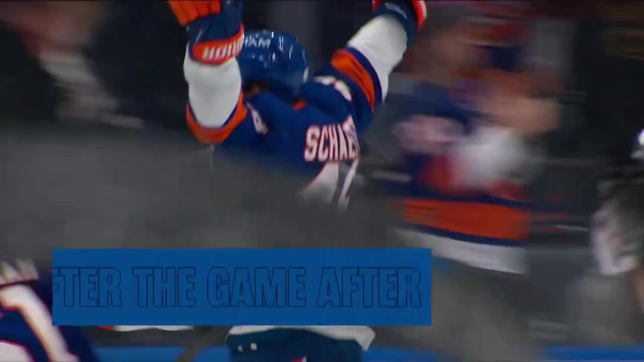 John Tavares watching on as Matthew Scha...