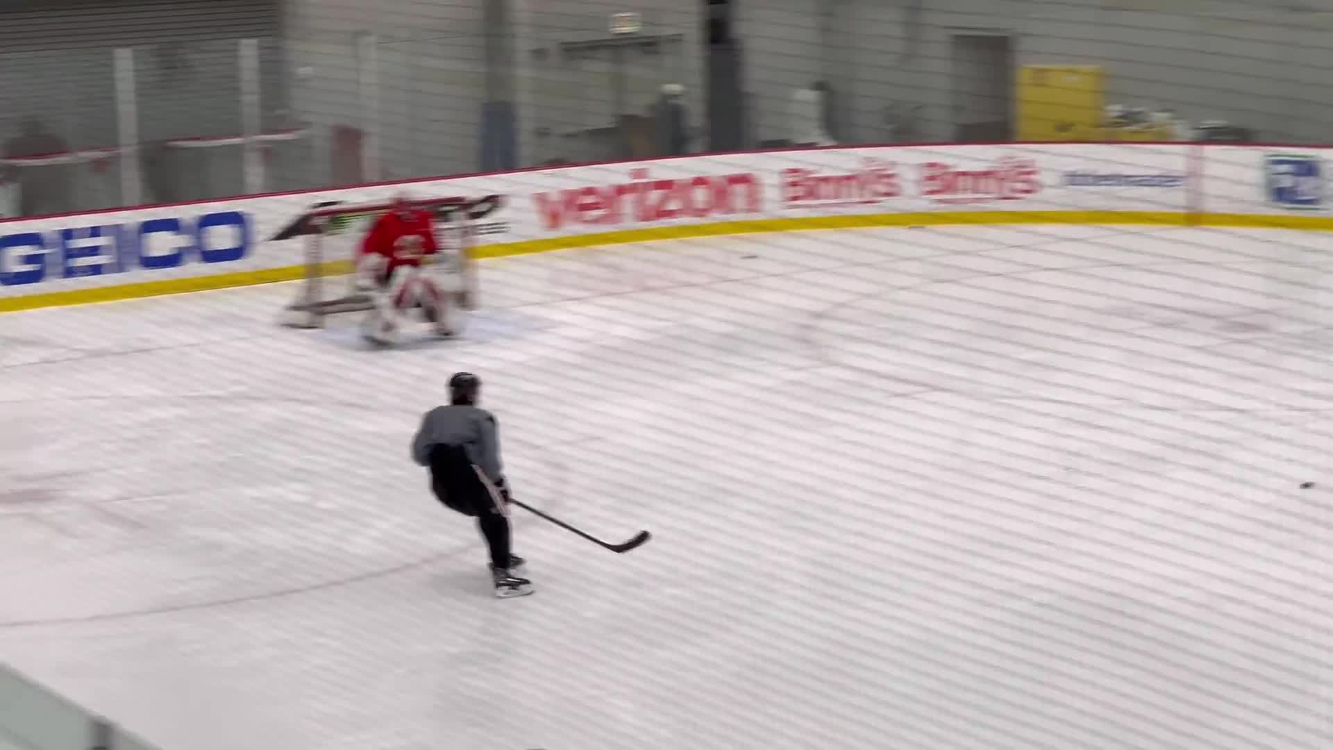 Connor Bedard and Frank Nazar are on the ice before practice in non-contact jerseys