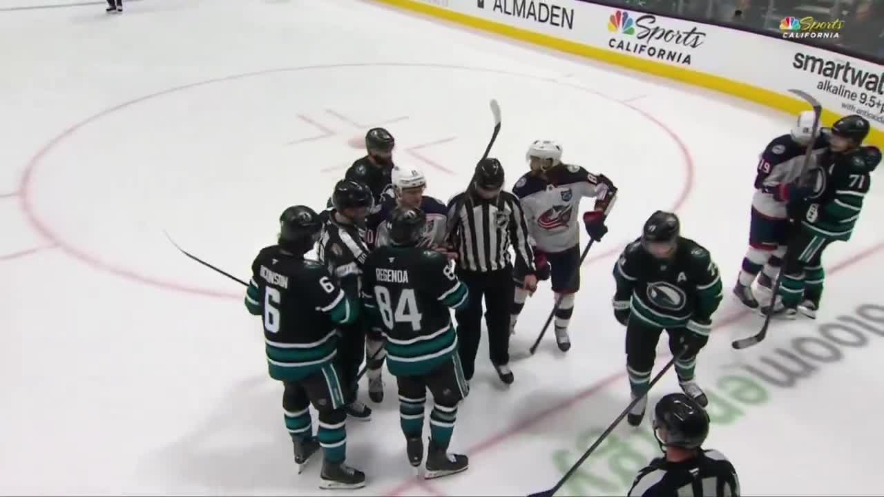 mack and fantilli hugging during the little scrum