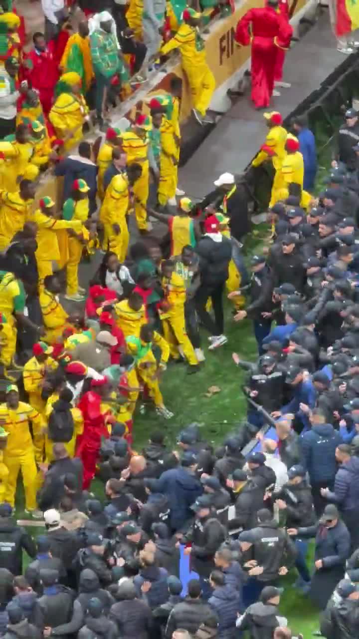 The Senegal fans clashing with police in...