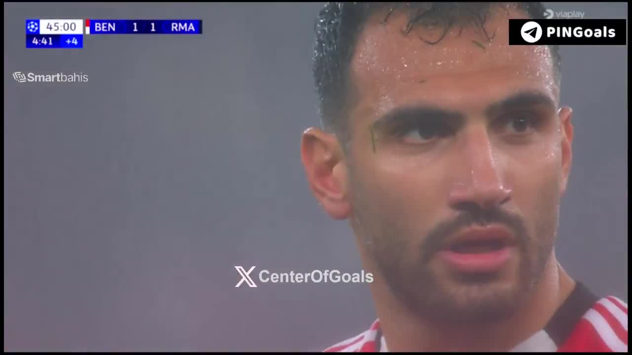 The penalty kick ends up in the back of ...