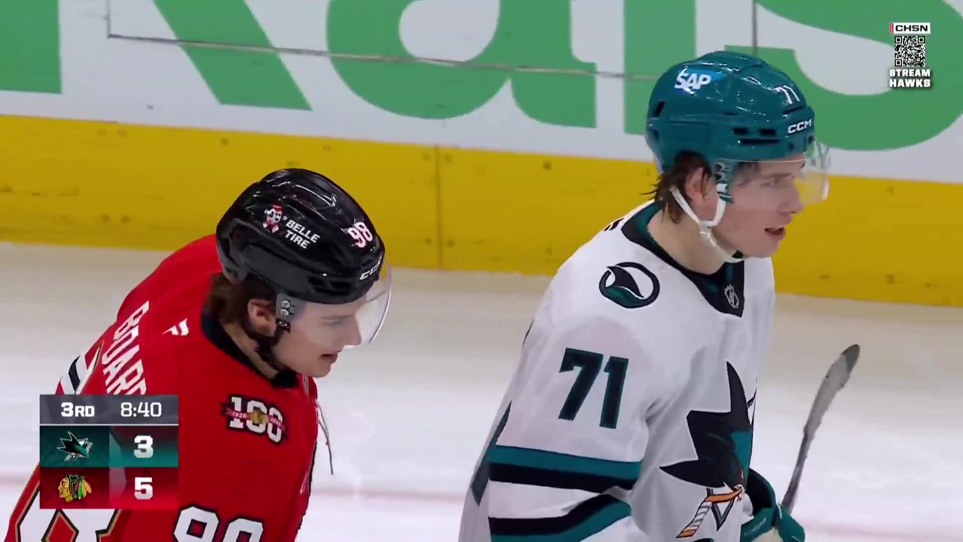 Bedard and Celebrini talking after a whi... (1)