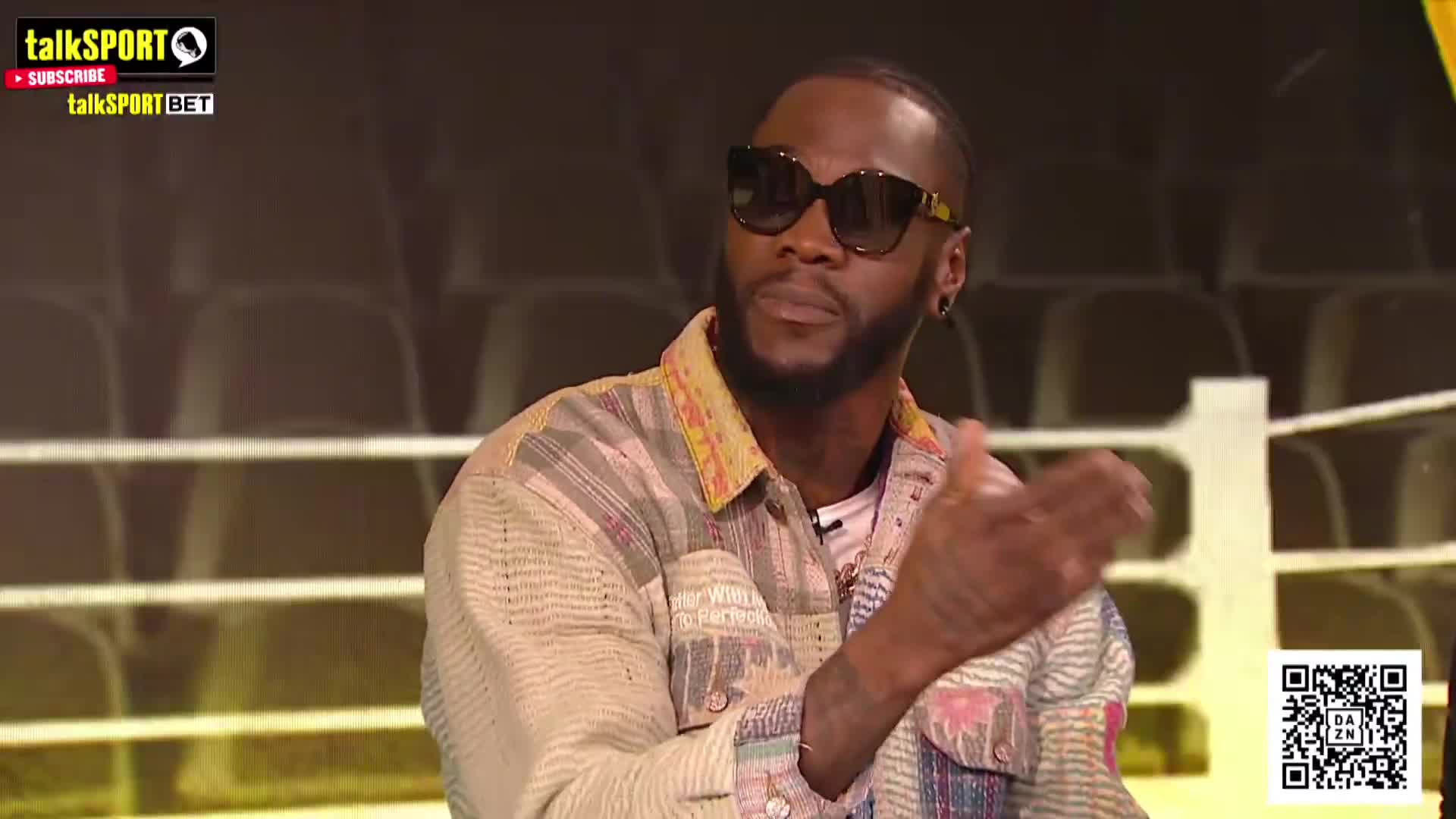 Deontay Wilder had to be held back by se...