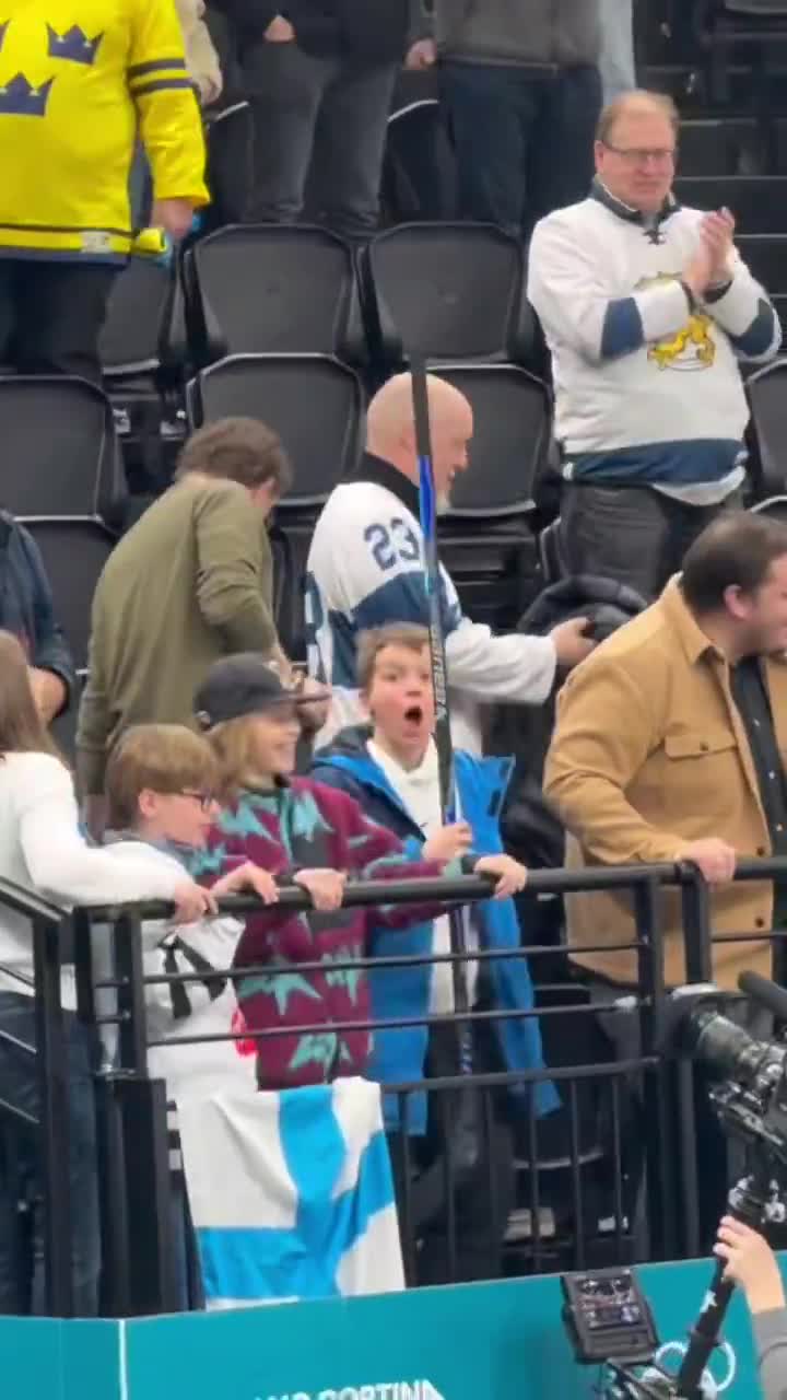 Rantanen gives kid his stick after game....