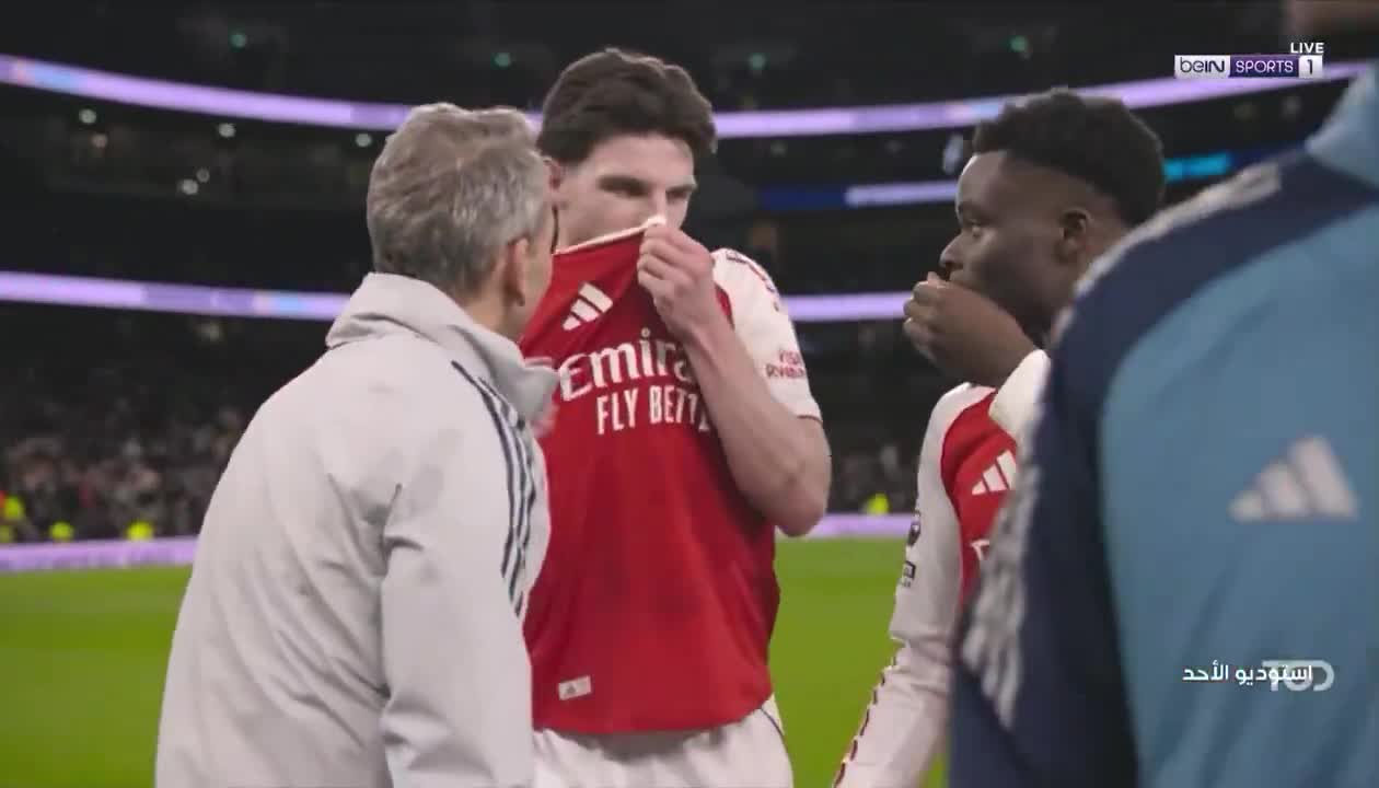Declan Rice to Bukayo Saka, on a Tottenham fan mockingly showing a picture of his girlfriend