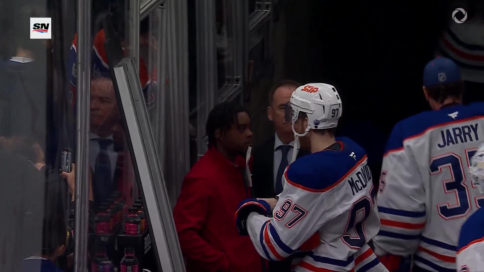 McDavid handing out autographs after a b... (1)