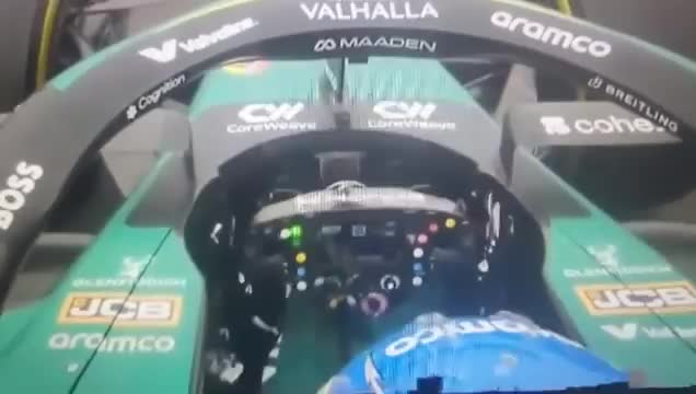 Fernando Alonso letting go of the steering wheel on the straights to rest his hands