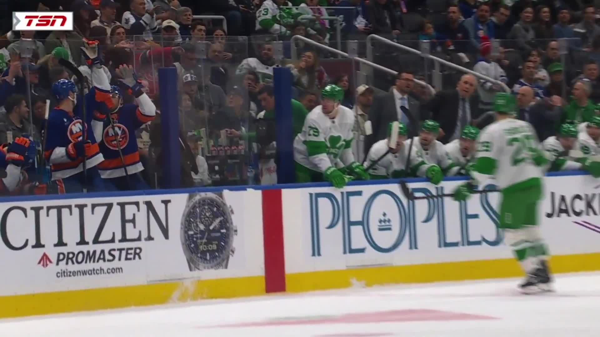 The puck got deflected out of play and ended up hitting the ONE fan in Scotiabank Arena rocking a Habs sweater at a Leafs and Isles game.