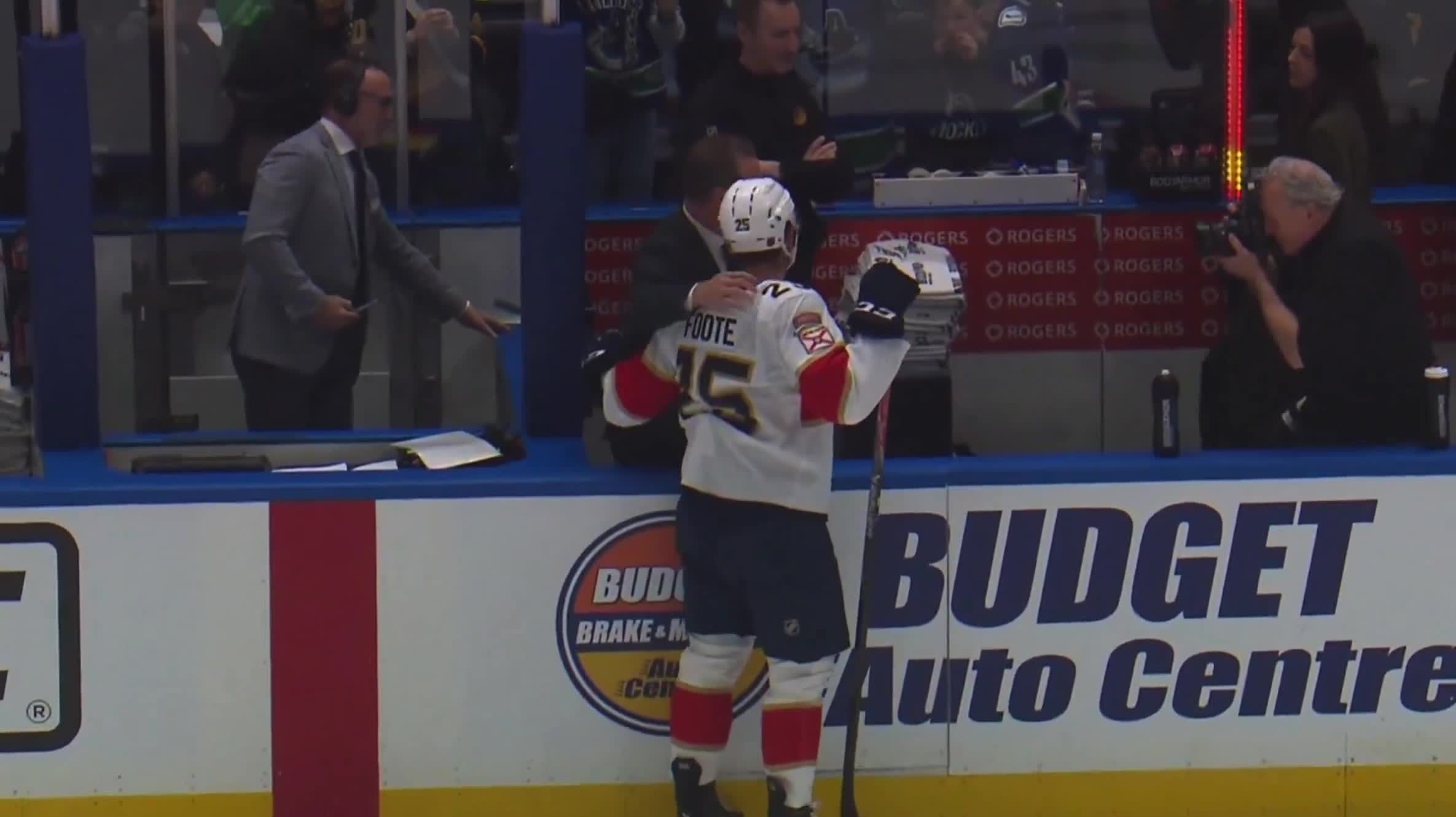 Canucks head coach Adam Foote posed for a photo with his son Nolan Foote who he's coaching against tonight