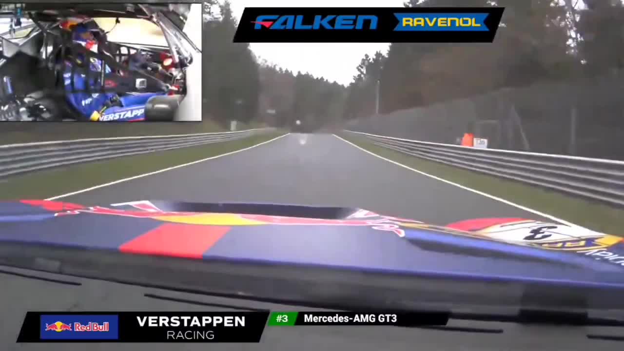 Max Verstappen overtaking on the grass and close to the wall.