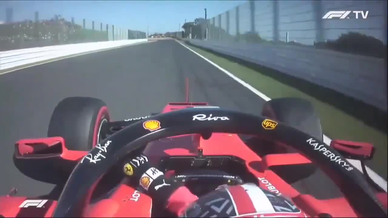 Charles Leclerc taking 130R with one hand while holding the mirror with the other – Japanese GP 2019