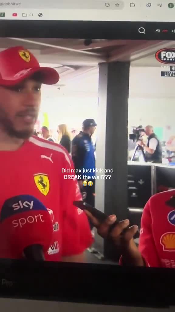 Max Verstappen seen inspecting a pillar during Hamilton’s interview