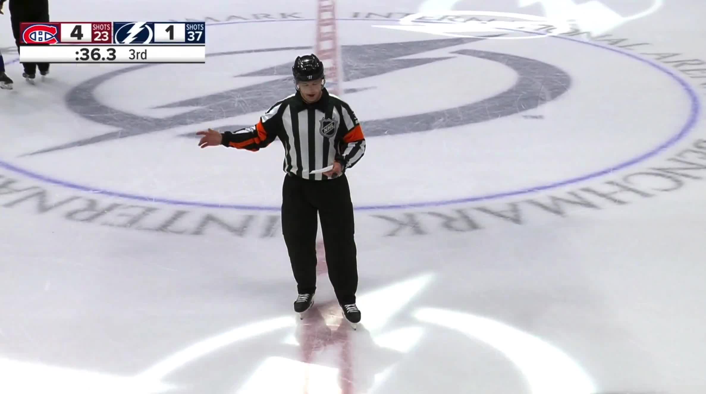 Referee pulls out the big pad after handing out 2-minute roughing penalties to every player on the ice