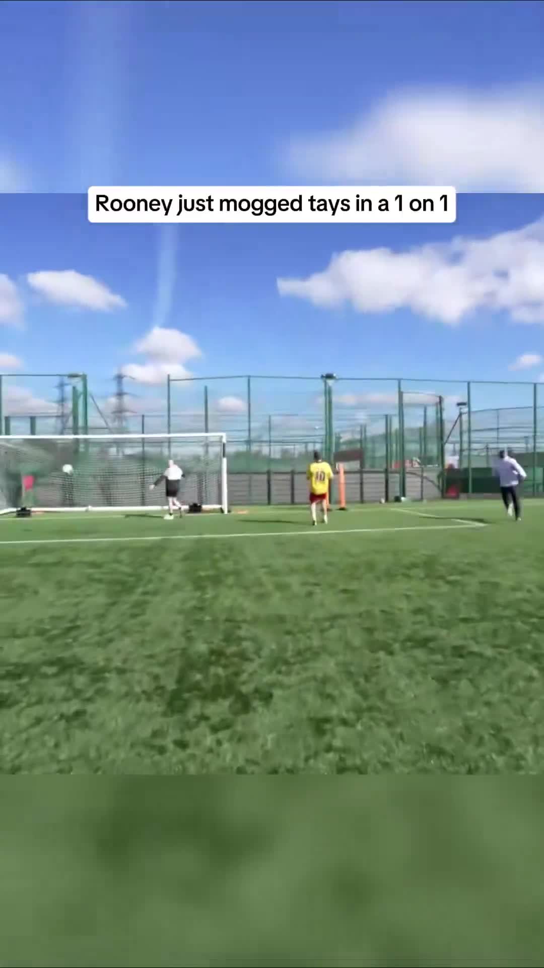 Wayne Rooney beats a player in a 1v1 situation during a training session.