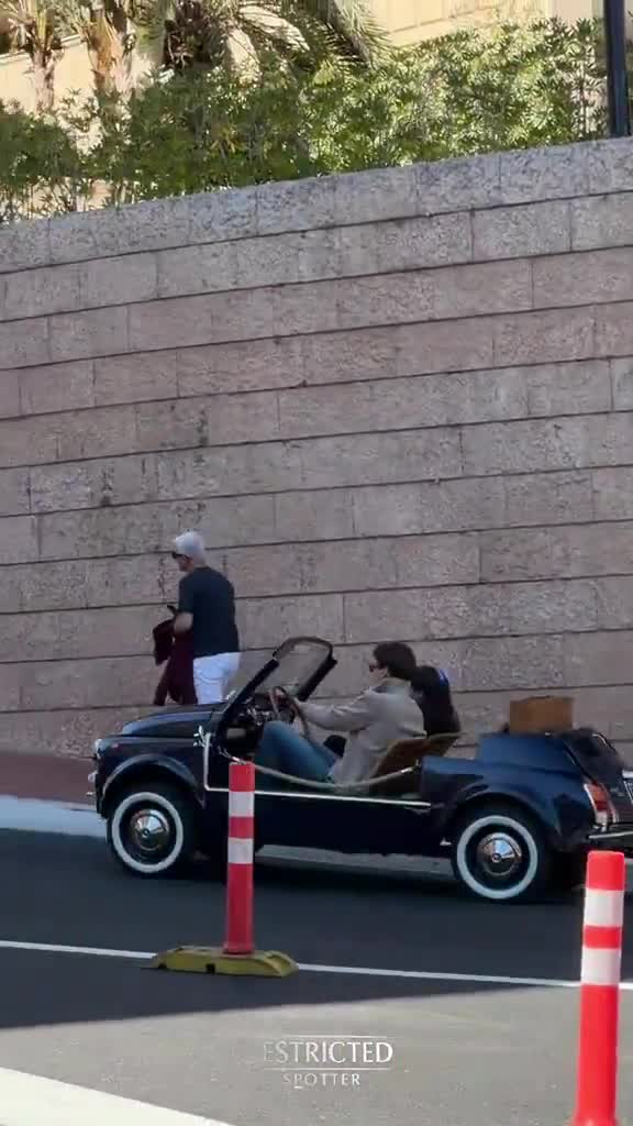 George Russell driving a Fiat 500 Jolly with Carmen through the streets of Monaco