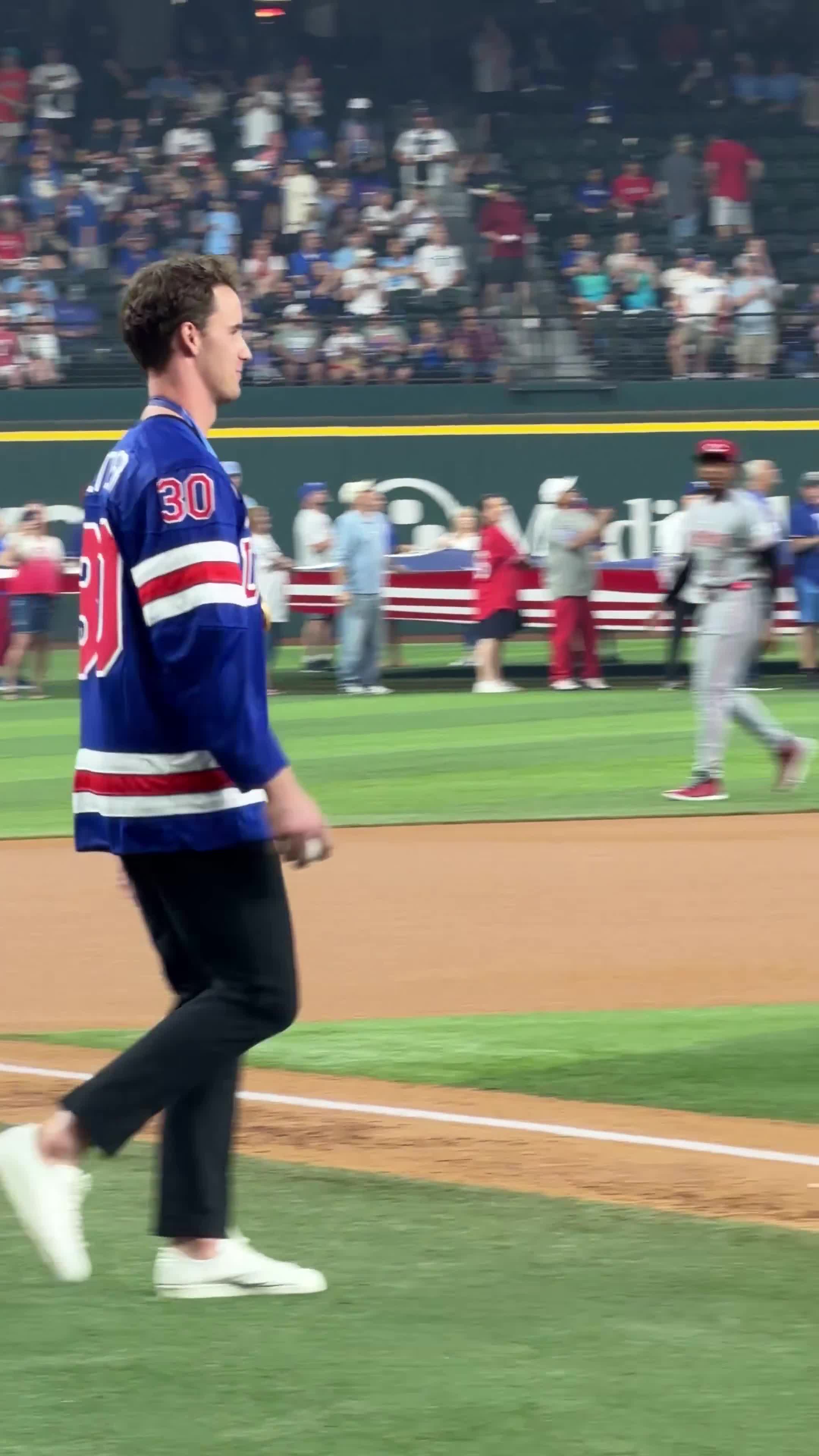 Dallas Stars goalie & Olympic gold medalist Jake Oettinger throws the ceremonial first pitch at the Rangers’ home opener