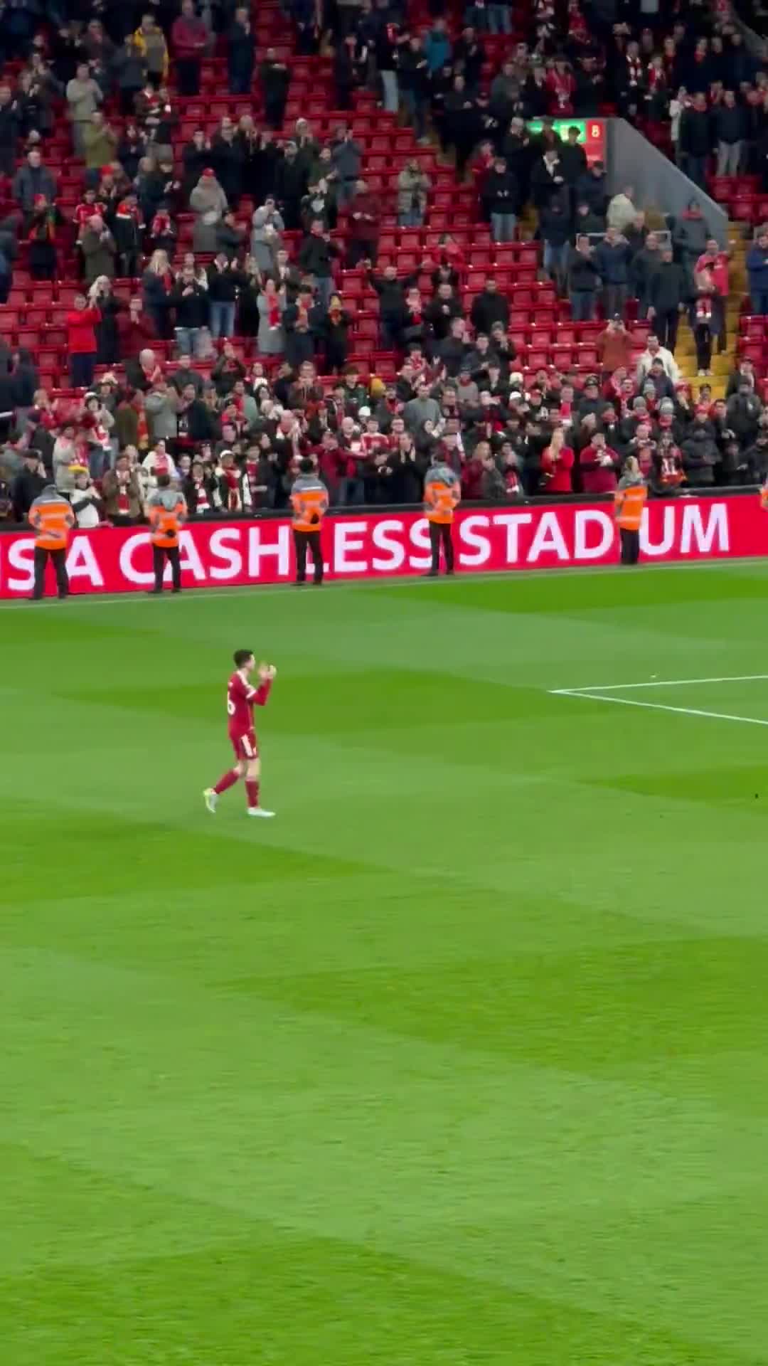 Liverpool fans at Anfield paying tribute to Andy Robertson and Mo Salah.