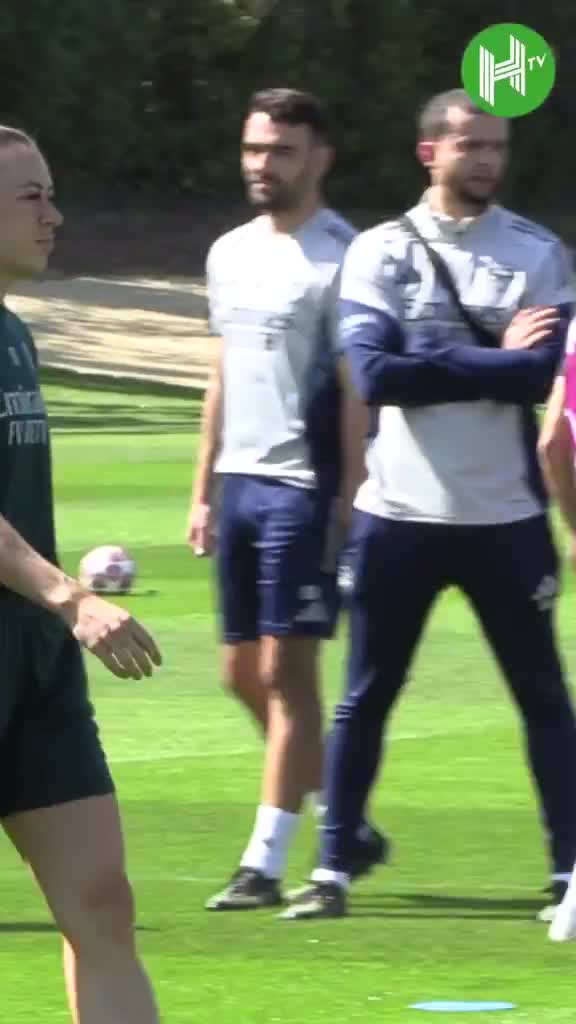 Alessia Russo and Olivia Smith perform the 'scuba dance' during Arsenal training