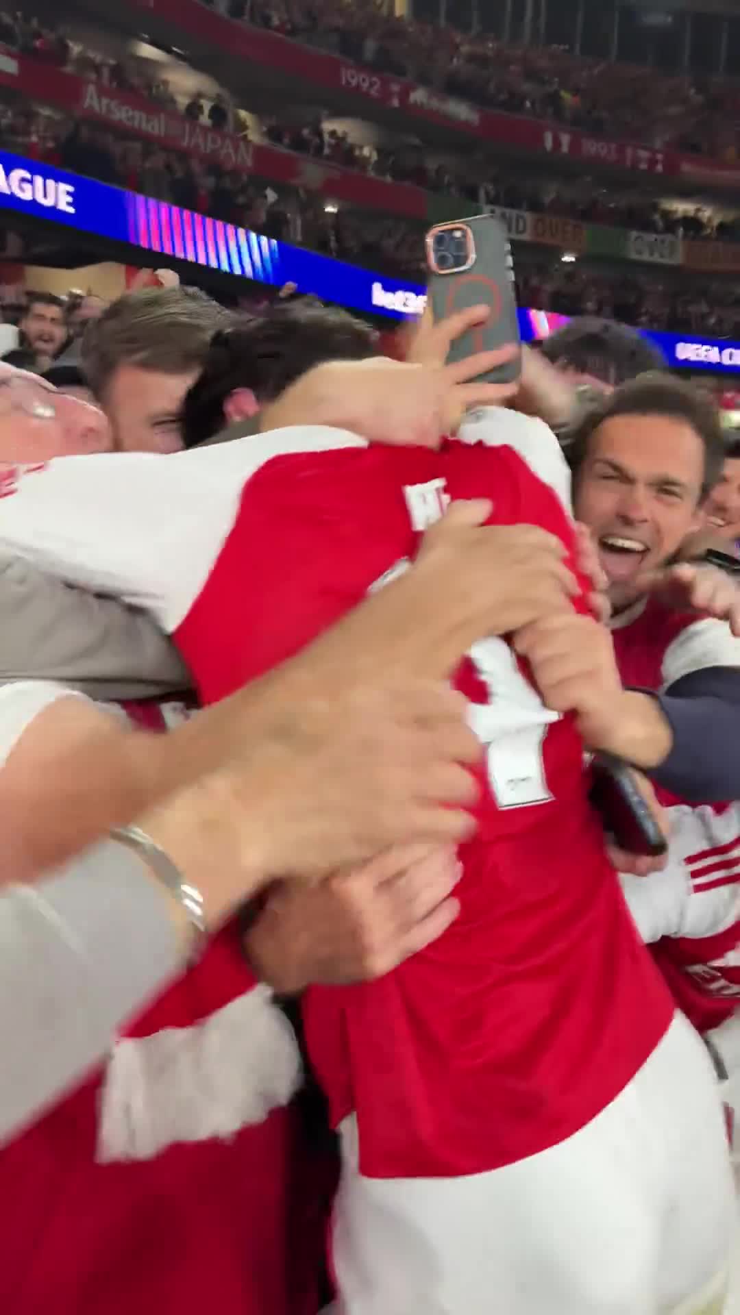 Declan Rice celebrating with the Arsenal fans at full-time.